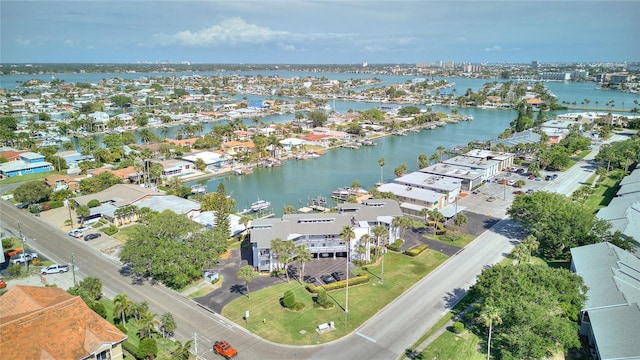 birds eye view of property with a water view and a residential view