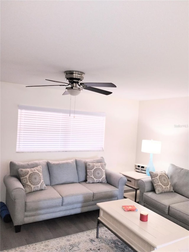 living room featuring a ceiling fan and wood finished floors