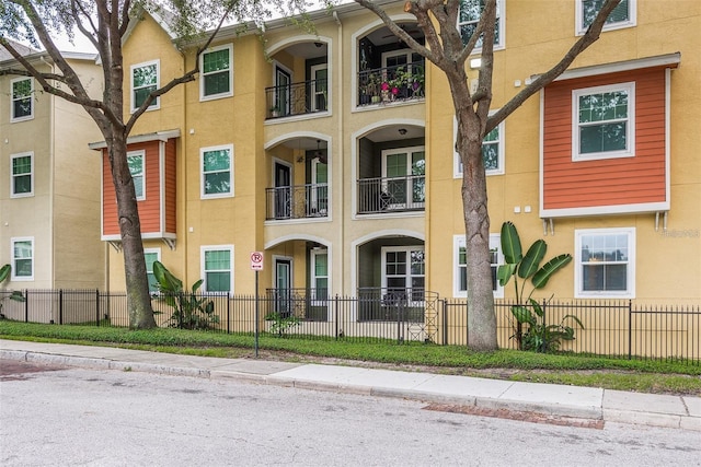 view of building exterior featuring a fenced front yard