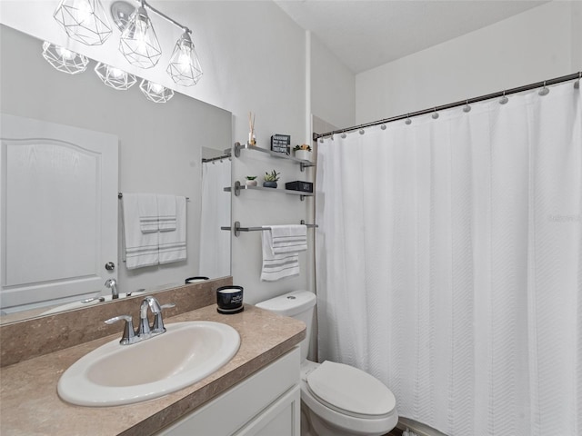 full bathroom featuring toilet and vanity