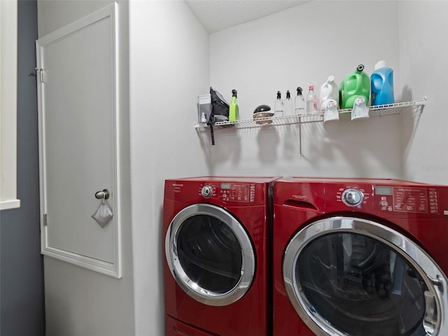 laundry area featuring laundry area and washer and clothes dryer