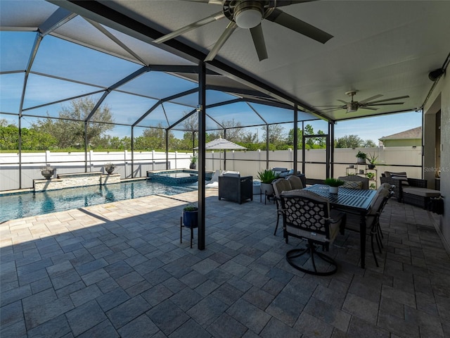 view of patio / terrace with a ceiling fan, a pool with connected hot tub, a lanai, and fence