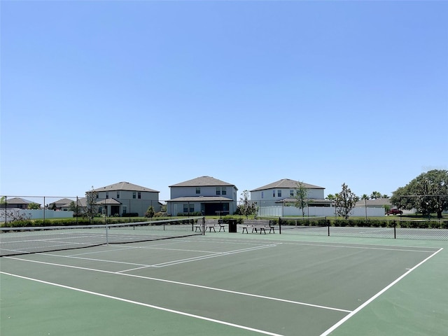 view of sport court with fence