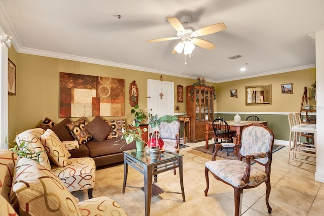 living room with visible vents, ornamental molding, light tile patterned flooring, and a ceiling fan