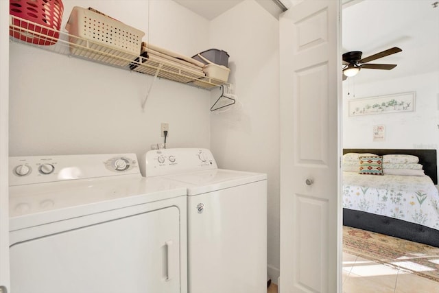 clothes washing area with laundry area, ceiling fan, and washer and clothes dryer