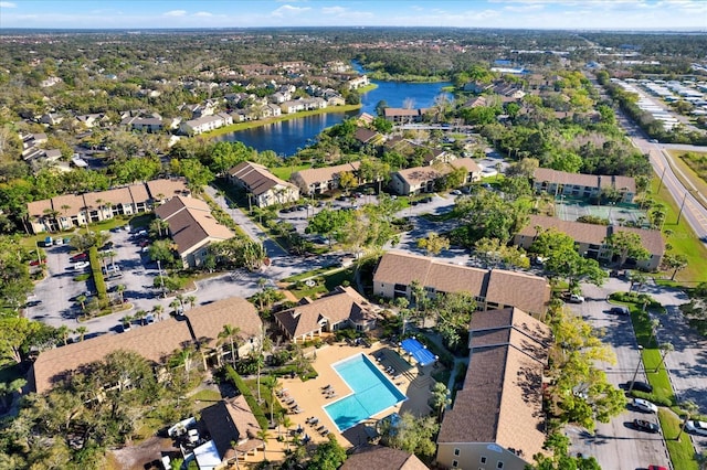 birds eye view of property featuring a water view and a residential view