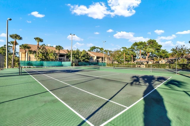 view of sport court with fence