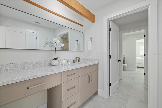 full bathroom with ensuite bath, visible vents, baseboards, and vanity