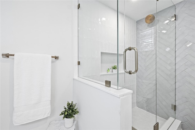 bathroom with a shower stall