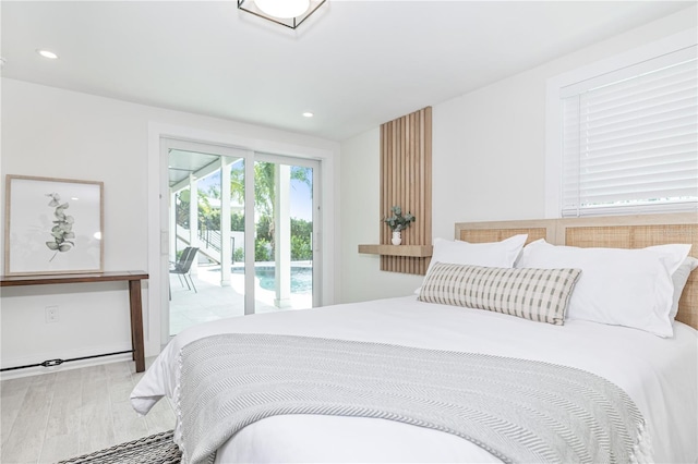 bedroom with access to exterior, recessed lighting, and wood finished floors