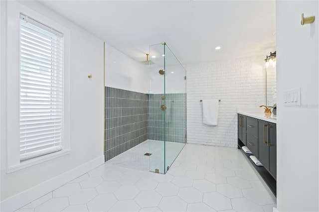 bathroom featuring walk in shower, vanity, and tile patterned floors