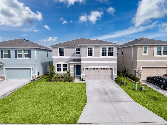 traditional home featuring a garage, driveway, stone siding, stucco siding, and a front lawn