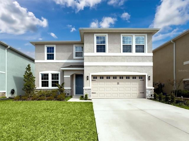 view of front of home featuring a front yard, stone siding, concrete driveway, and stucco siding