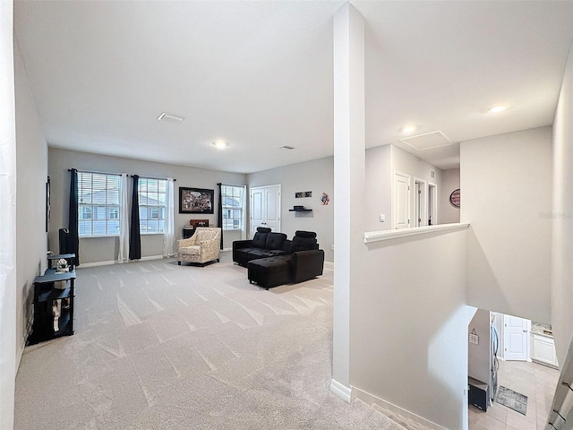 interior space with carpet flooring, visible vents, and baseboards