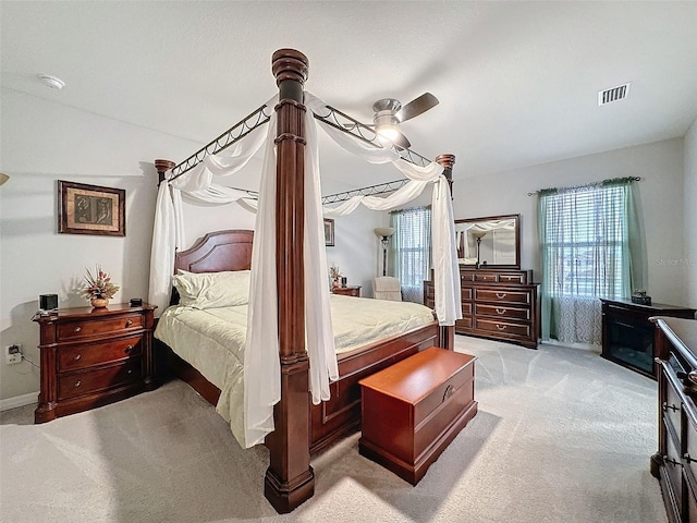 bedroom with light carpet and visible vents