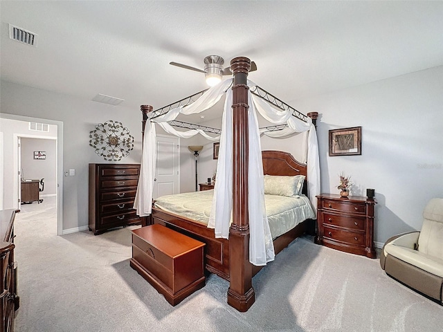 bedroom with light carpet, baseboards, visible vents, and a ceiling fan