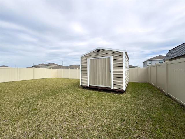 view of shed featuring a fenced backyard