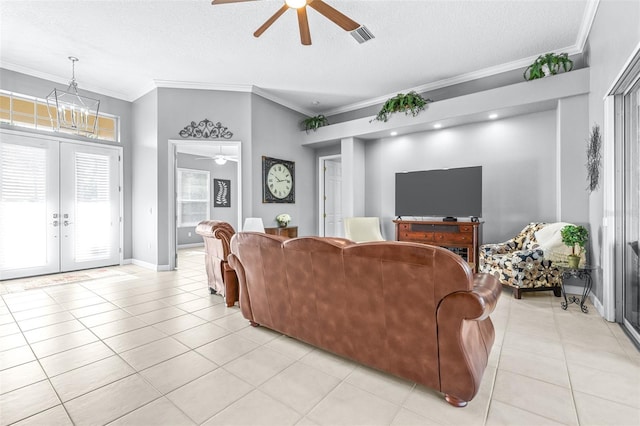 living area featuring light tile patterned floors, visible vents, crown molding, and french doors