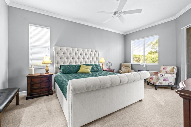 bedroom featuring baseboards, carpet floors, ceiling fan, and crown molding