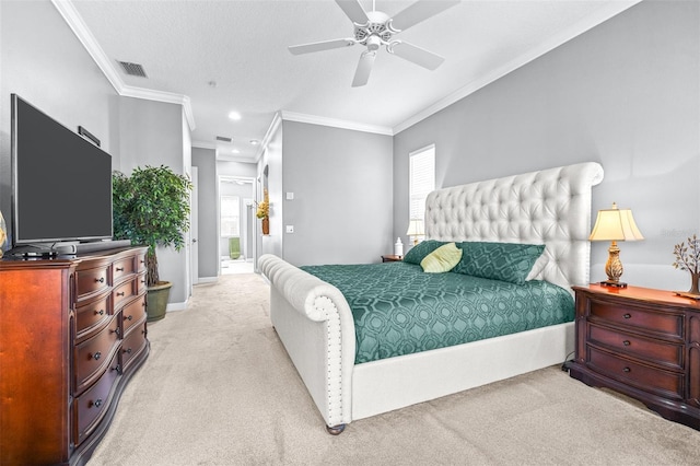 bedroom with crown molding, a ceiling fan, visible vents, and light carpet