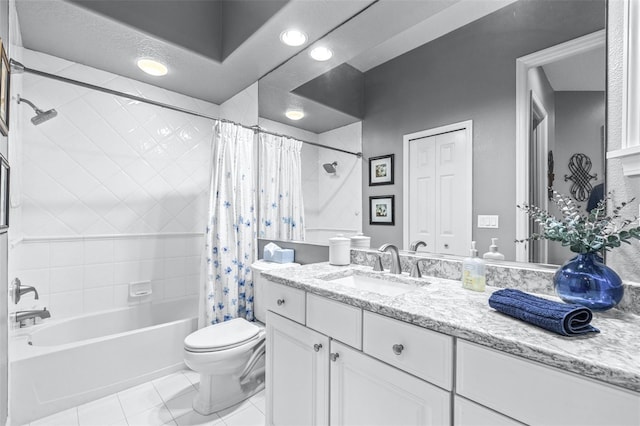 full bathroom featuring tile patterned floors, shower / bathtub combination with curtain, toilet, a textured ceiling, and vanity