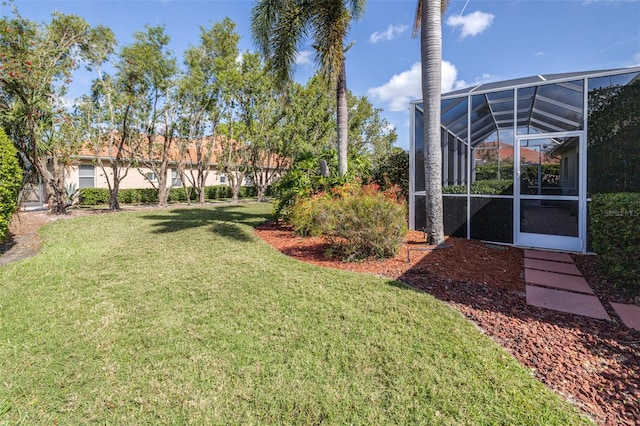 view of yard featuring glass enclosure