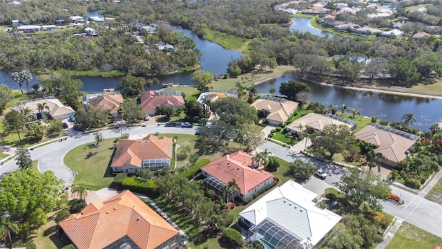 bird's eye view with a residential view and a water view