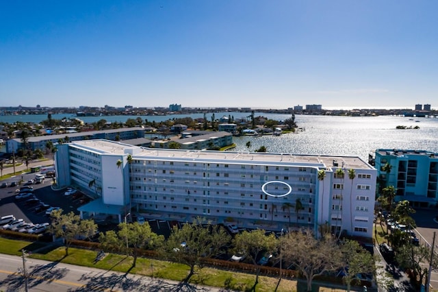 birds eye view of property featuring a city view and a water view