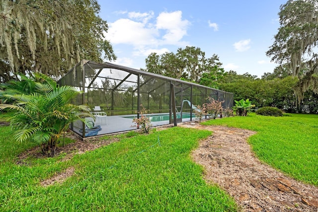 exterior space featuring a pool and a yard