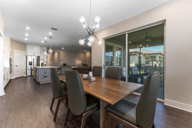 dining space with dark wood-style floors, baseboards, visible vents, and recessed lighting