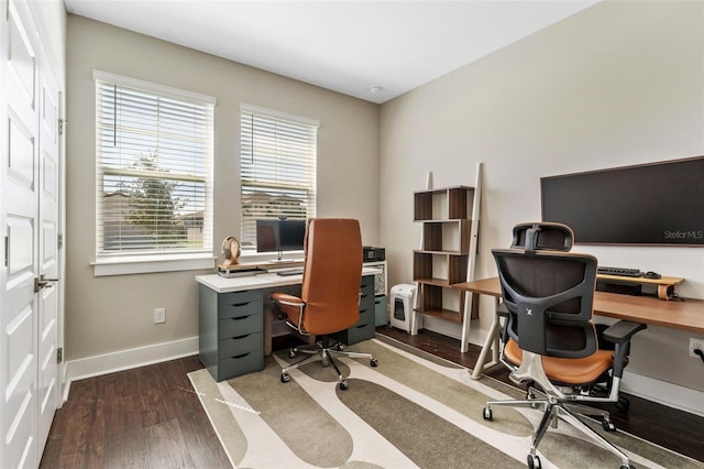 office space featuring dark wood-type flooring and baseboards