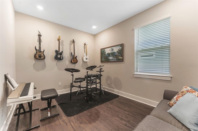 workout room with recessed lighting, wood finished floors, and baseboards