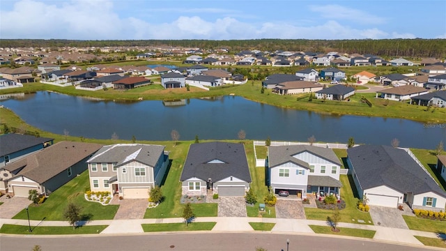 bird's eye view with a water view and a residential view