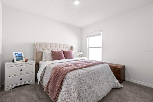 carpeted bedroom with baseboards