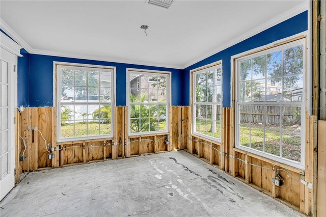 unfurnished sunroom with visible vents