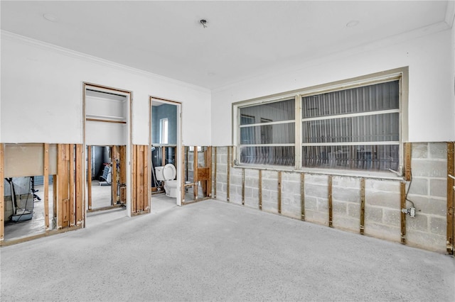 unfurnished bedroom featuring crown molding