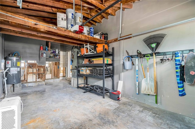 garage with a garage door opener and electric water heater