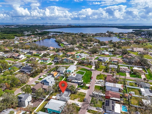 bird's eye view featuring a residential view and a water view