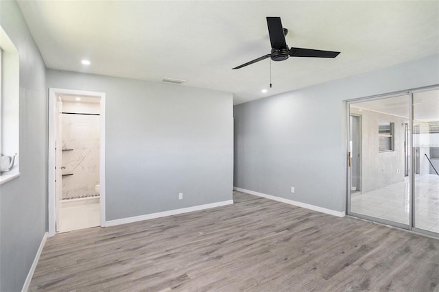 unfurnished bedroom featuring visible vents, baseboards, wood finished floors, and recessed lighting