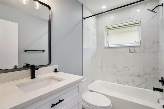 bathroom with toilet, bathing tub / shower combination, and vanity