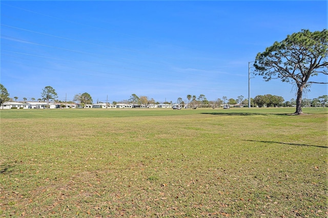 view of home's community with a lawn