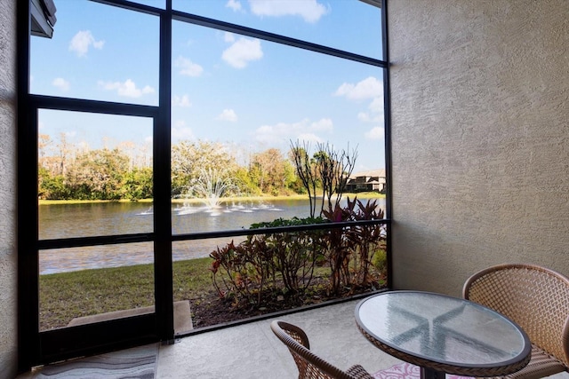 sunroom with a water view