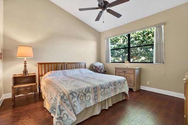 bedroom with dark wood-style floors, ceiling fan, baseboards, and vaulted ceiling