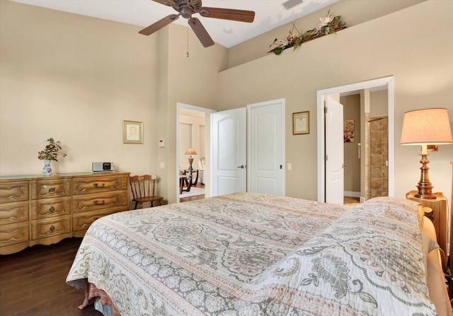 bedroom featuring visible vents, dark wood finished floors, and a ceiling fan