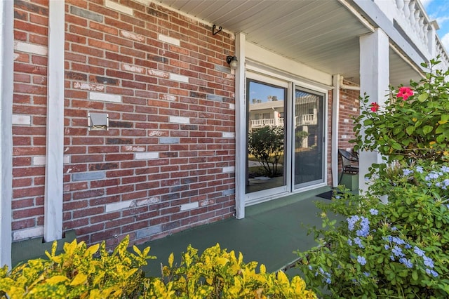 view of side of home with brick siding