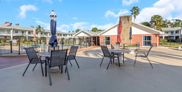 view of patio / terrace with outdoor dining area and fence