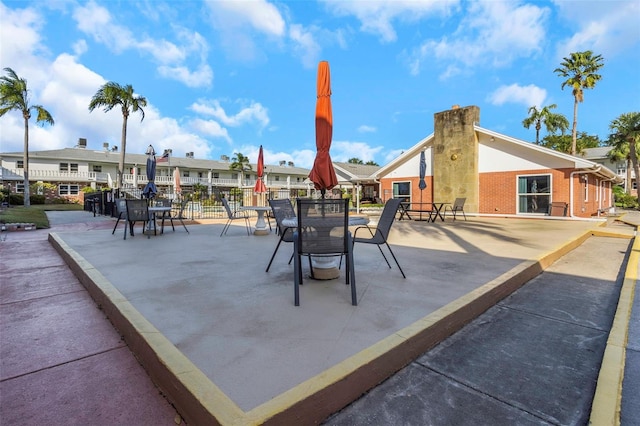 view of patio / terrace featuring a residential view and outdoor dining space