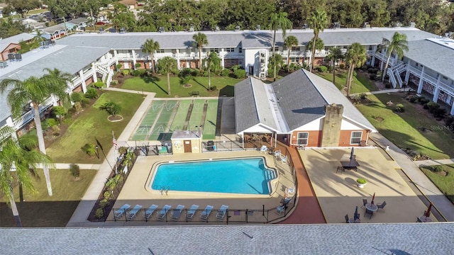 view of swimming pool with a residential view