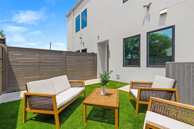 view of patio featuring fence and an outdoor living space