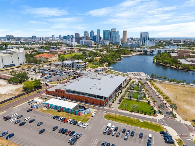 birds eye view of property featuring a view of city and a water view